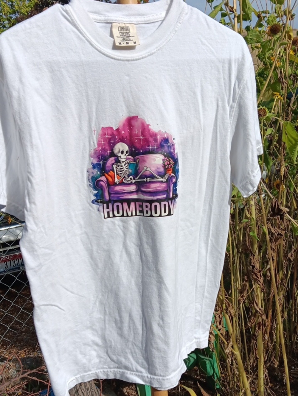 Comfort Colors White Tee with Colorful Skeleton Couch Graphic
